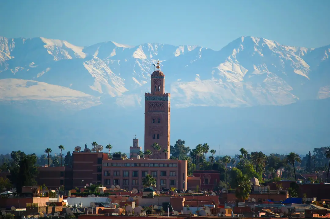 The Koutoubia minaret in Marrakech with the snow-capped Atlas Mountains behind